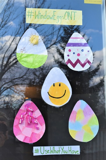 Paper eggs hanging in a window